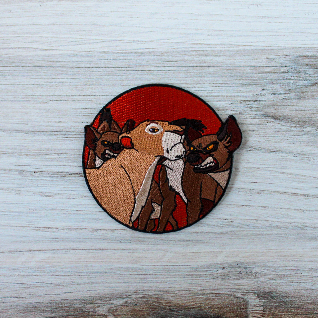 Lioness and Hyenas Iron on Patch